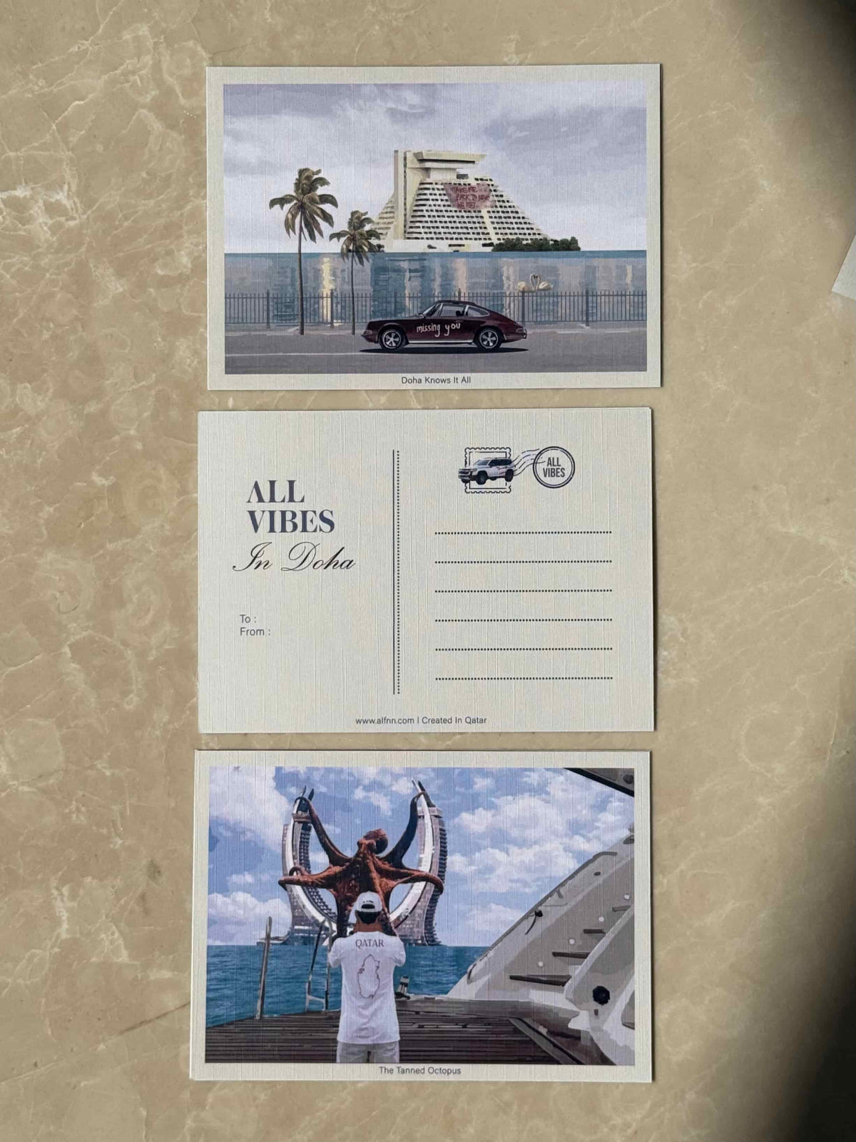 Doha Knows It All postcard - vintage Porsche by Sheraton Doha hotel
The Tanned Octopus postcard - Katara Towers Doha with octopus 
