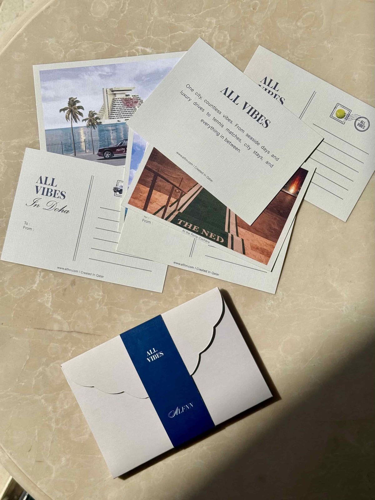 AL FNN All Vibes In Doha postcard collection - six designs with intro card and navy envelope