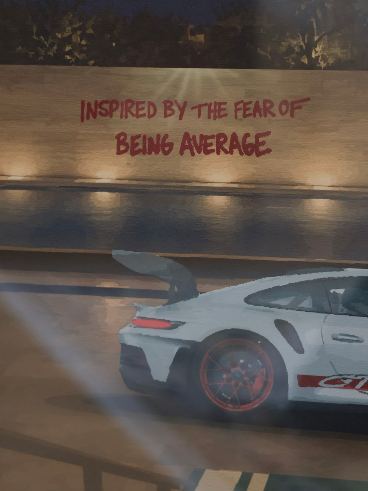 "Inspired by the fear of being average" text with Porsche GT3 RS